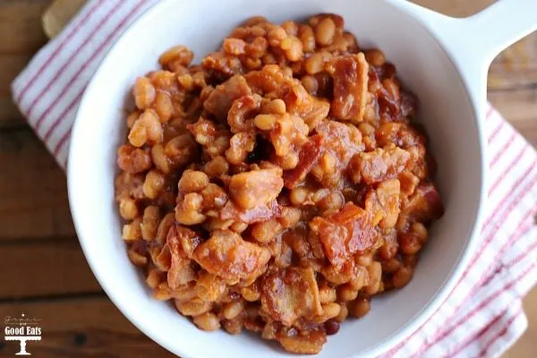 baked beans with bacon in white dish