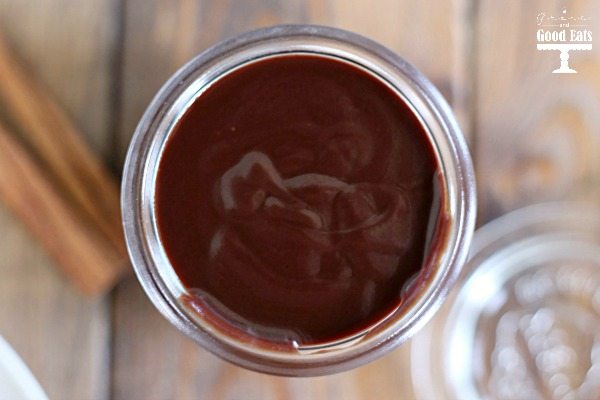 Overhead view of Mexican chocolate sauce in a glass jar. 