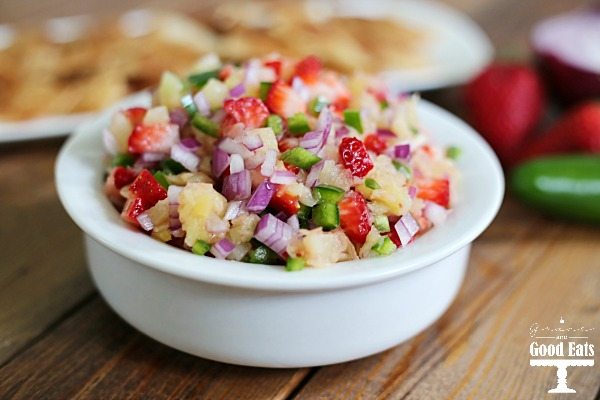 white bowl overflowing with fruit salsa