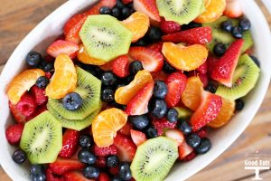 This fruit salad with honey lime dressing is the only recipe you need for all of your summer celebrations! It is my go-to recipe when I need to bring something to a BBQ or picnic. Fresh, colorful berries paired perfectly with a honey lime glaze you will want to eat with a spoon.