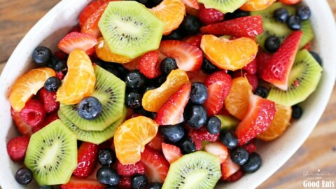 This fruit salad with honey lime dressing is the only recipe you need for all of your summer celebrations! It is my go-to recipe when I need to bring something to a BBQ or picnic. Fresh, colorful berries paired perfectly with a honey lime glaze you will want to eat with a spoon.