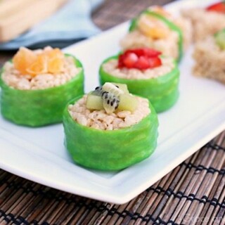 fruit sushi treats wrapped in fruit leather and topped with fresh kiwi