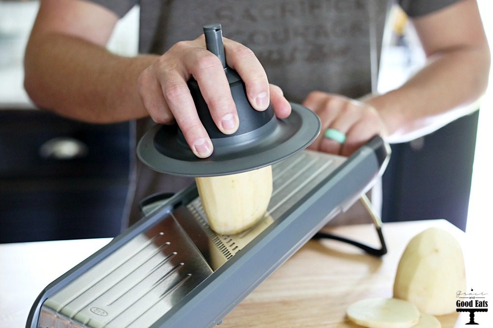 man demonstrating the OXO Mandoline