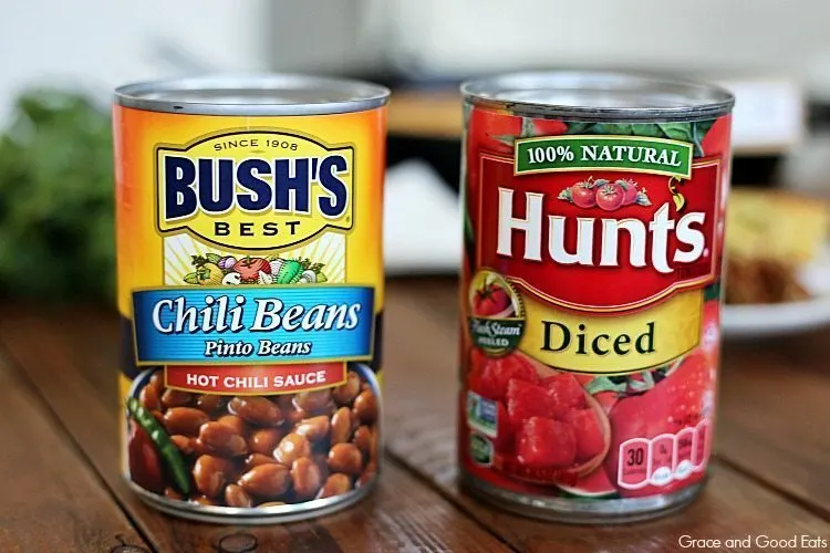 Cans of Bush's chili beans and Hunt's Diced Tomatoes