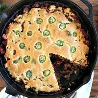 This Kickin' Chili Cornbread Pie is hearty, meaty, spicy goodness. Perfect for a cold night and easy enough for a weeknight meal.