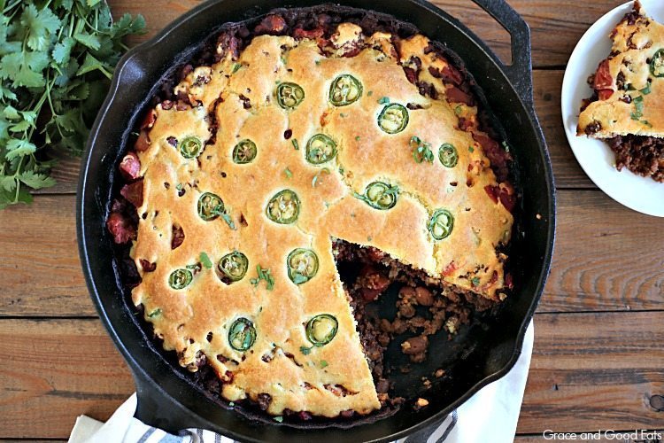 overhead view of chili cornbread bake in a cast iron skillet 