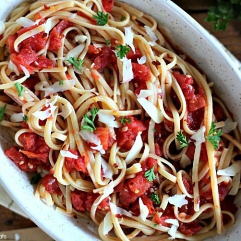 This Arrabbiata, or spicy marinara, combines tomatoes, red chili, garlic, olive oil for a delicious sauce with a kick.  Serve this simple linguine arrabbiata with a loaf of crusty French bread and extra olive oil for dipping!