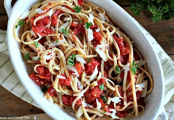 This Arrabbiata, or spicy marinara, combines tomatoes, red chili, garlic, olive oil for a delicious sauce with a kick.  Serve this simple linguine arrabbiata with a loaf of crusty French bread and extra olive oil for dipping!