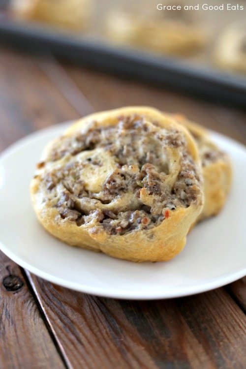 two sausage pinwheels on a white plate 