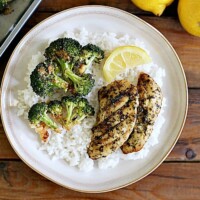 Cooked Perfect Lemon Herb Chicken and Parmesan Roasted Broccoli come together to create a one Sheet Pan Lemon Chicken.  This dish is an easy weeknight meal and bakes in under twenty minutes.
