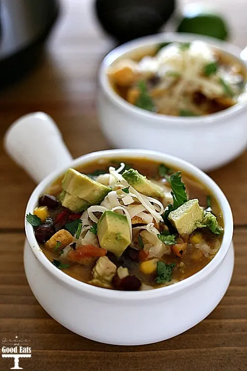 hearty bowl of chicken tortilla soup with black beans, corn, tomatoes, and cilantro lime chicken