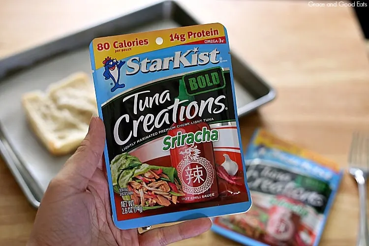 hand holding a pouch of StarKist tuna