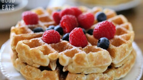 thick waffles topped with blueberries and raspberries