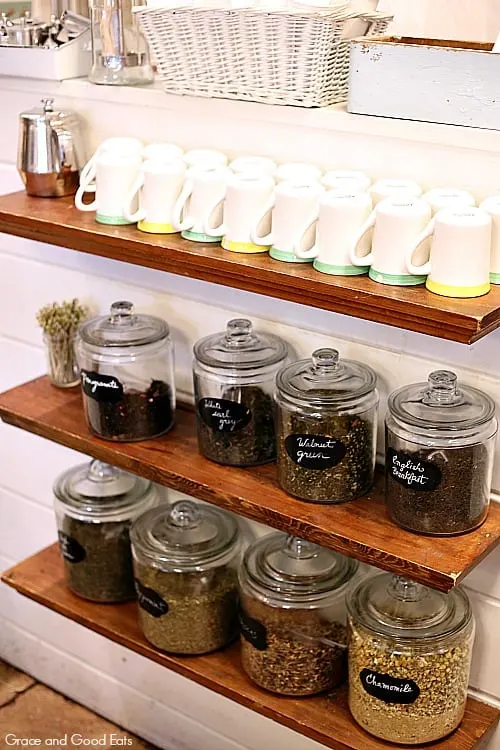 shelves with coffee cups and whole coffee beans