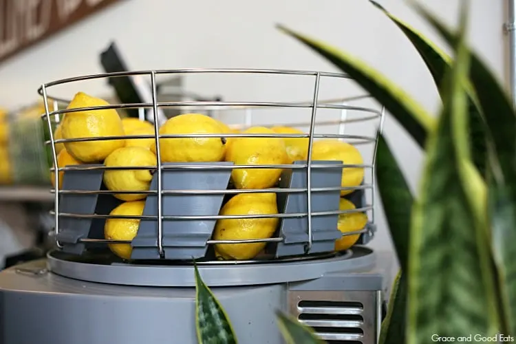 lemons on top of a juicer