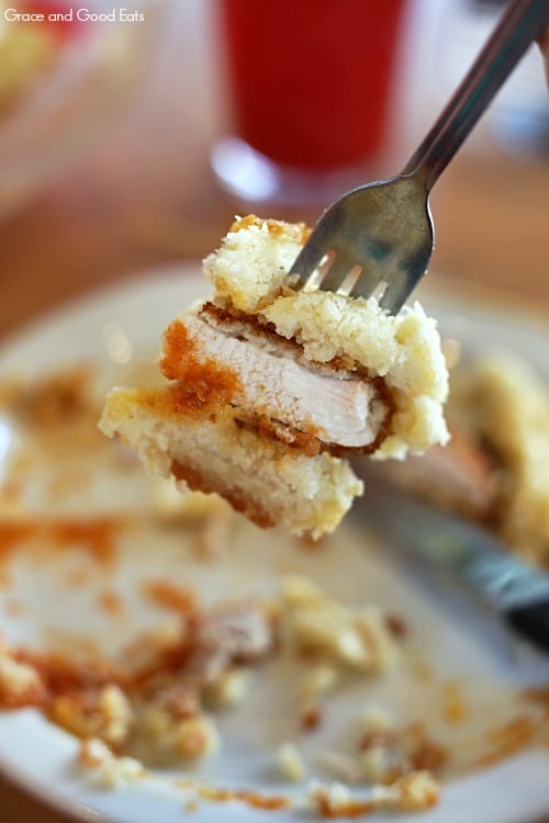 a bite of chicken biscuit with a fork