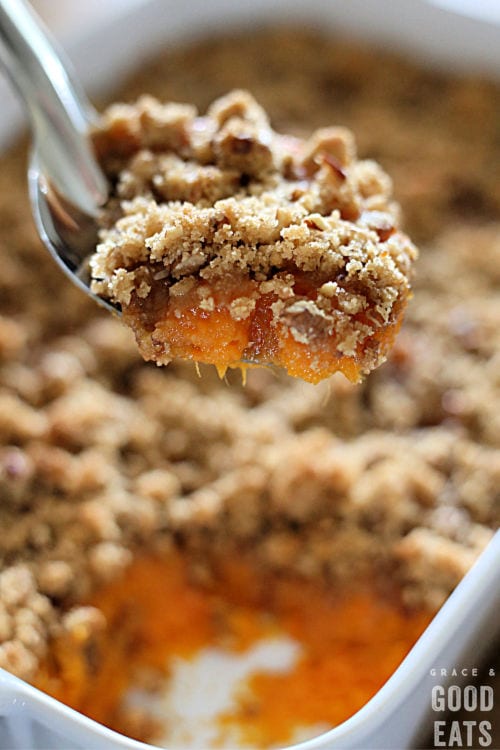 scoop of sweet potato casserole in a metal spoon