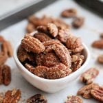 small white bowl of pecans