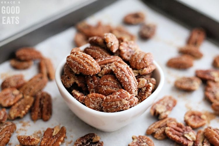 small white bowl of cinnamon pecans