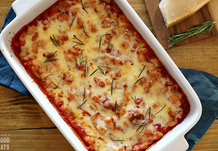 cheesy Italian canned baked beans in a white rectangular dish