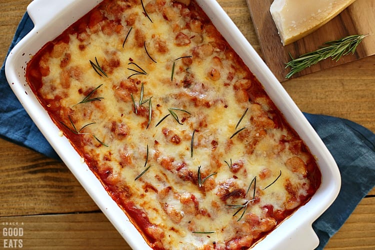 cheesy Italian canned baked beans in a white rectangular dish
