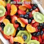 This fruit salad with honey lime dressing is the only recipe you need for all of your summer celebrations! It is my go-to recipe when I need to bring something to a BBQ or picnic. Fresh, colorful berries paired perfectly with a honey lime glaze you will want to eat with a spoon.