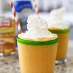 pumpkin smoothie in a glass with whipped cream