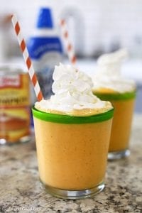 pumpkin smoothie in a glass with whipped cream