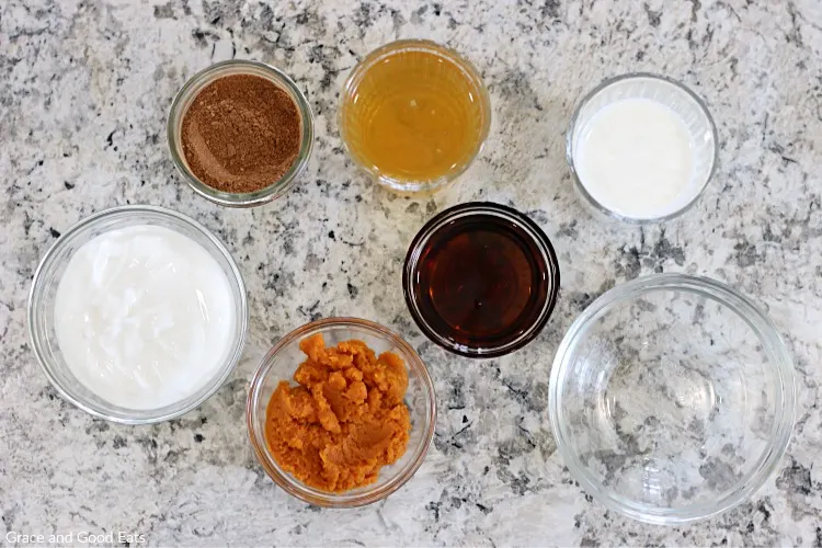 pumpkin smoothie ingredients in glass bowls