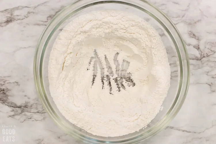 well in the center of dry ingredients in a glass bowl