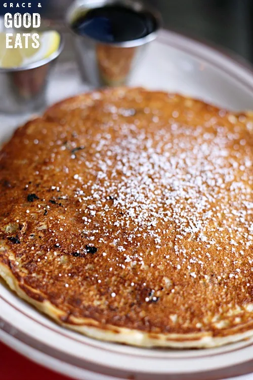 blueberry pancakes dusted with powdered sugar