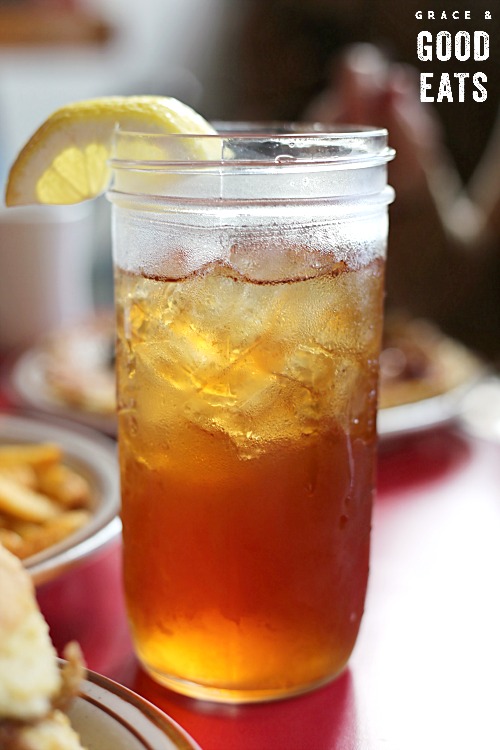 glass of sweet tea in a mason jar with lemon