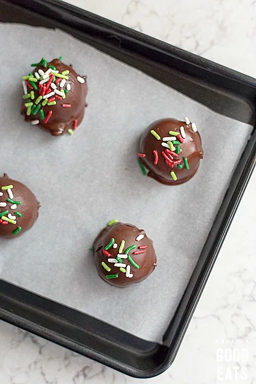 chocolate truffles on a baking sheet