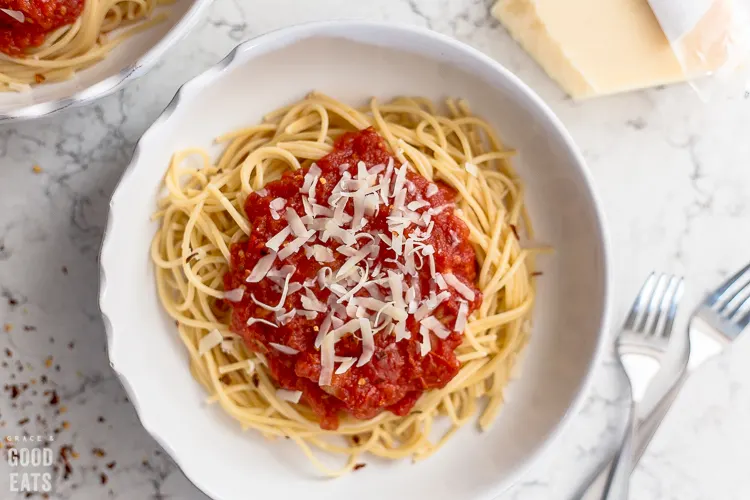 plate full of noodles with marinara