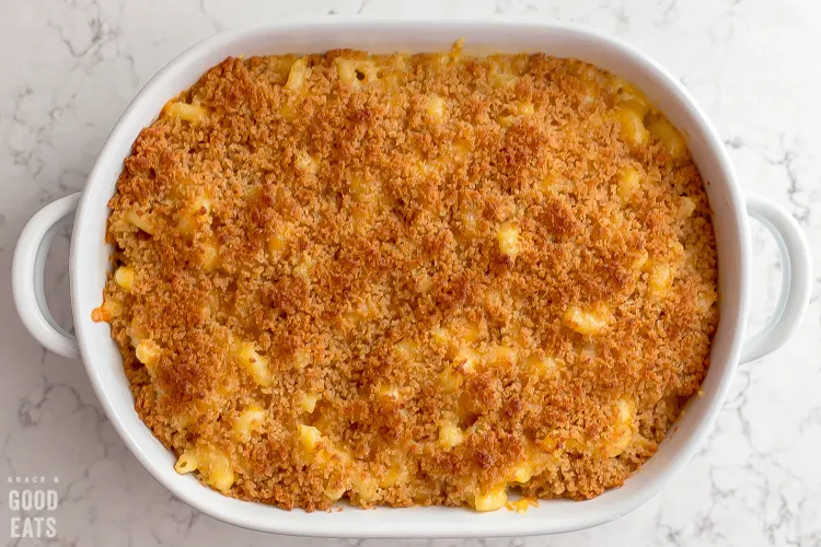 mac and cheese topped with Panko in a casserole dish