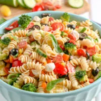 ceramic blue bowl filled with pasta salad