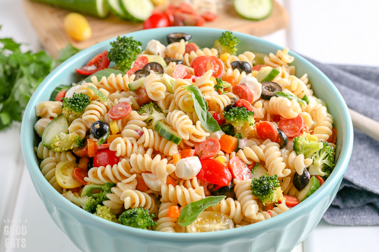 ceramic blue bowl filled with pasta salad