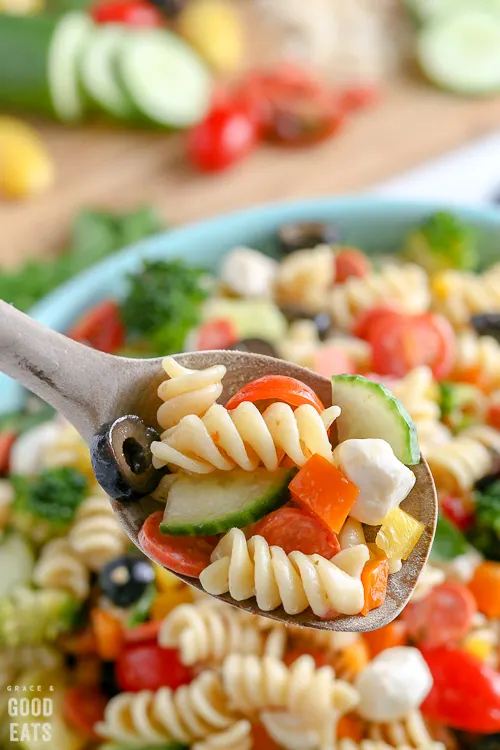 wooden spoon full of pasta salad