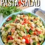 Italian Pasta Salad made with crunchy veggies, fresh mozzarella, tender rotini noodles, and a simple dressing.  This easy pasta salad recipe is deliciously flavorful as is, but also totally flexible- omit the meat, add in your favorite veggies, or sub in different cheeses to your liking.