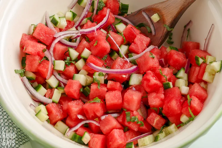 bowl of ingredients with a wooden spoon