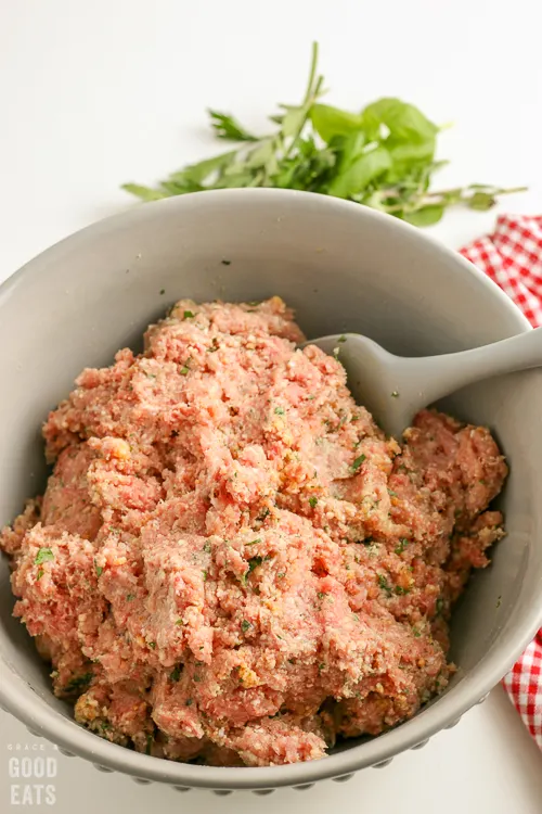 raw meatball mixture in a mixing bowl