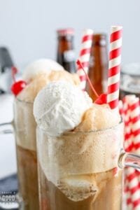 zoomed in view of root beer float in mugs