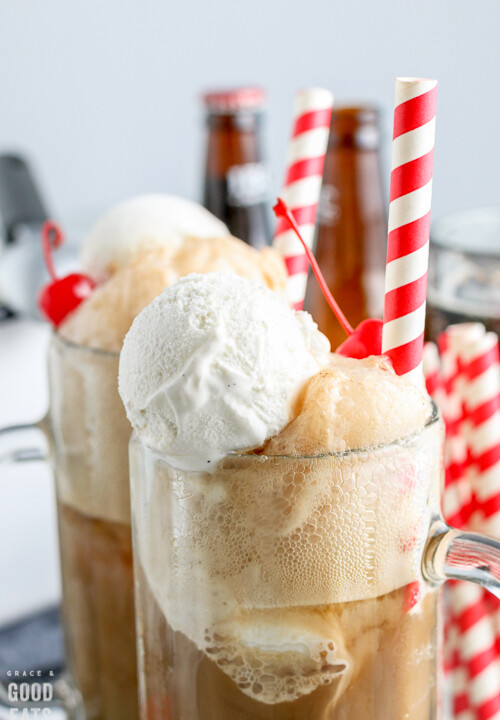 zoomed in view of root beer float in mugs