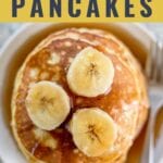 3 ingredient pancakes topped with bananas on a plate with a fork