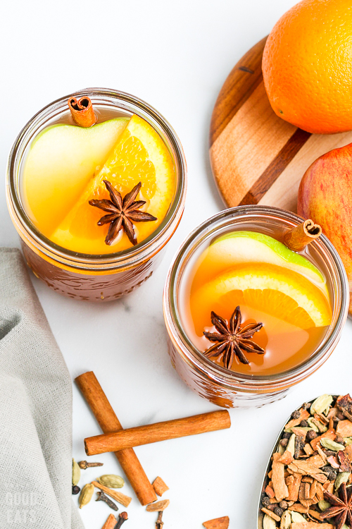 overhead view of two classes with orange slices and cinnamon sticks