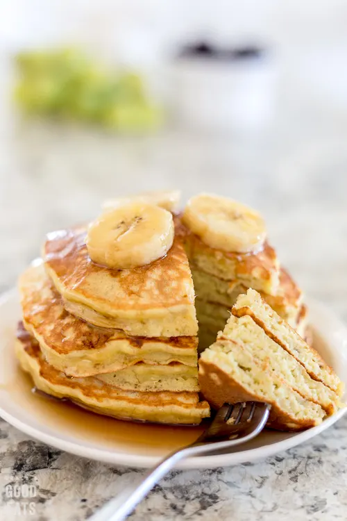 pancakes with a triangle cut out and speared with a fork