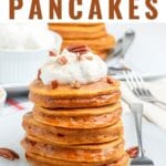 Pumpkin Pancake Recipe made with real pumpkin and seasonal spices. These pumpkin pancakes are perfect for fall with whipped cinnamon butter and maple syrup!