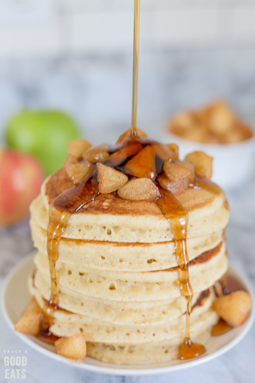 stream of syrup pouring over pancakes