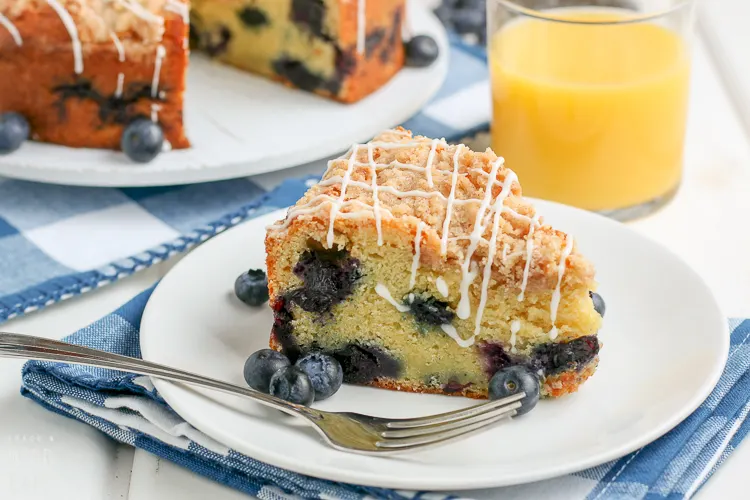 close up of a slice of blueberry coffee cake
