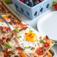 slice of breakfast pizza on a spatula